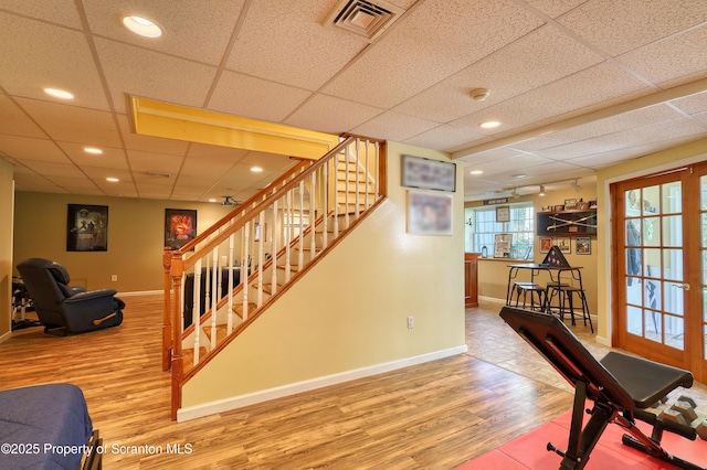 157 Mcesther Dr Unit L 31, Covington Twp, PA 18424 - stairs featuring wood finished floors, a paneled ceiling, and recessed lighting