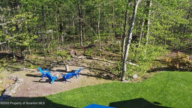 157 Mcesther Dr Unit L 31, Covington Twp, PA 18424 - view of green lawn featuring a fire pit