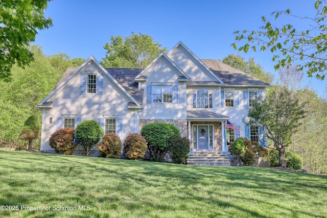 157 Mcesther Dr Unit L 31, Covington Twp, PA 18424 - view of front facade featuring a front lawn and stone siding