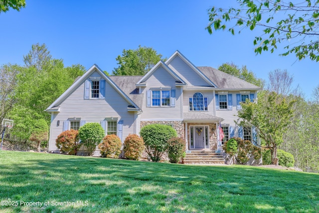 157 Mcesther Dr Unit L 31, Covington Twp, PA 18424 - view of front facade featuring a front yard and stone siding