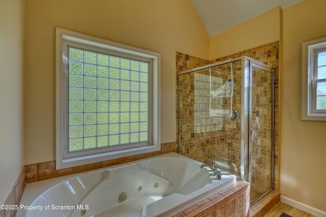 157 Mcesther Dr Unit L 31, Covington Twp, PA 18424 - bathroom with a shower stall, a jetted tub, and vaulted ceiling