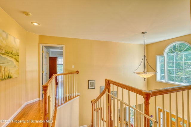 157 Mcesther Dr Unit L 31, Covington Twp, PA 18424 - hallway with an upstairs landing, wood finished floors, and recessed lighting