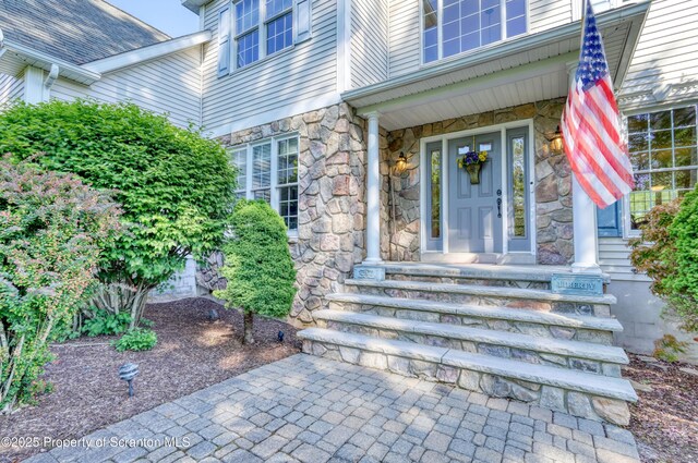 157 Mcesther Dr Unit L 31, Covington Twp, PA 18424 - view of exterior entry featuring stone siding