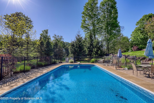 157 Mcesther Dr Unit L 31, Covington Twp, PA 18424 - view of swimming pool featuring a patio, view of scattered trees, and outdoor dining area