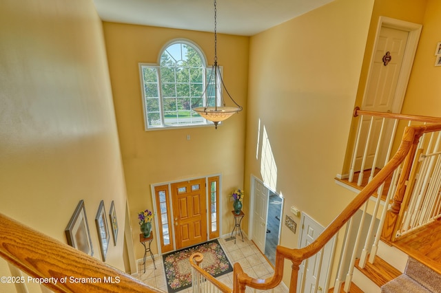 157 Mcesther Dr Unit L 31, Covington Twp, PA 18424 - entrance foyer with stairway and a towering ceiling