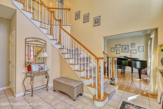 157 Mcesther Dr Unit L 31, Covington Twp, PA 18424 - stairs with a towering ceiling and tile patterned flooring