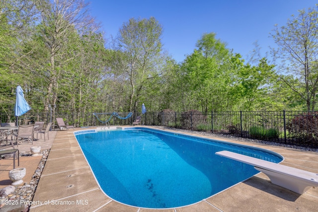 157 Mcesther Dr Unit L 31, Covington Twp, PA 18424 - view of pool featuring a diving board and a patio area