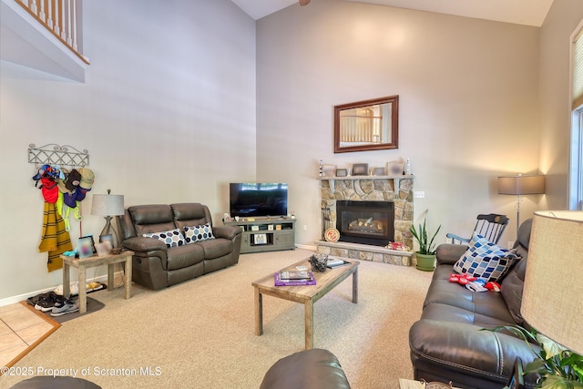 157 Mcesther Dr Unit L 31, Covington Twp, PA 18424 - living area with high vaulted ceiling, a stone fireplace, and carpet