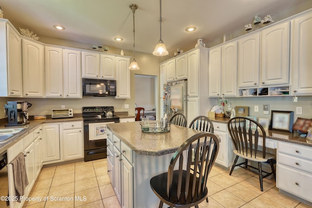 157 Mcesther Dr Unit L 31, Covington Twp, PA 18424 - kitchen with black appliances, recessed lighting, light tile patterned flooring, hanging light fixtures, and white cabinets