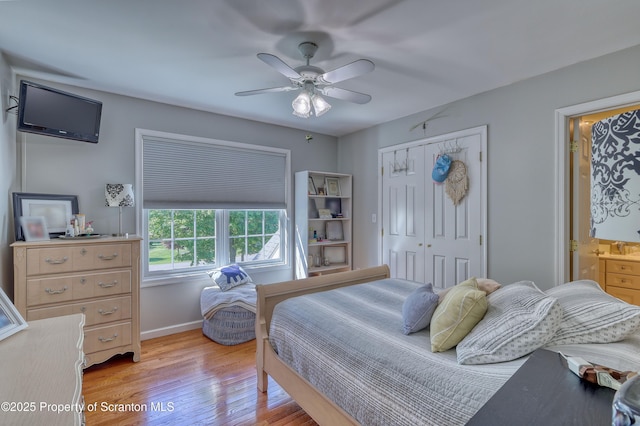 157 Mcesther Dr Unit L 31, Covington Twp, PA 18424 - bedroom with light wood-style flooring, a closet, ceiling fan, and connected bathroom