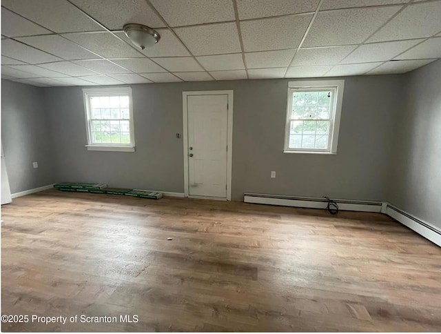 1034 Plane St, Avoca, PA 18641 - basement with baseboards, wood finished floors, and a paneled ceiling