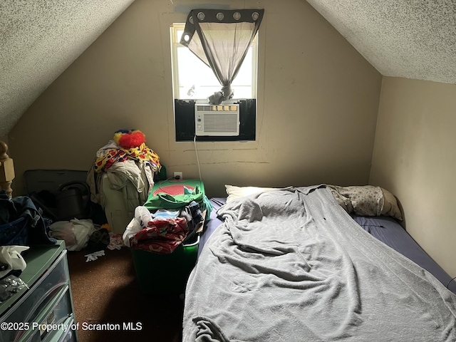 1034 Plane St, Avoca, PA 18641 - bedroom featuring carpet floors, cooling unit, vaulted ceiling, and a textured ceiling