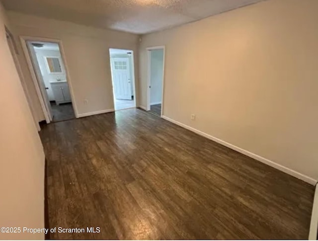 1034 Plane St, Avoca, PA 18641 - spare room featuring baseboards, dark wood finished floors, and a textured ceiling