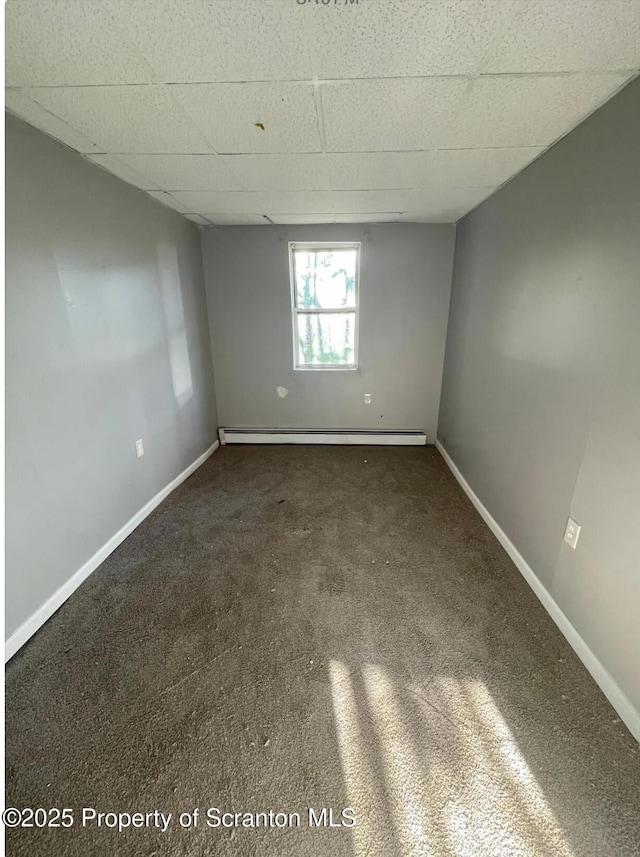 1034 Plane St, Avoca, PA 18641 - unfurnished room featuring baseboard heating, baseboards, carpet, and a drop ceiling