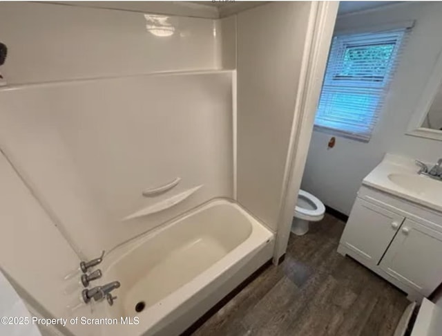 1034 Plane St, Avoca, PA 18641 - full bath featuring wood finished floors, toilet, shower / washtub combination, and vanity