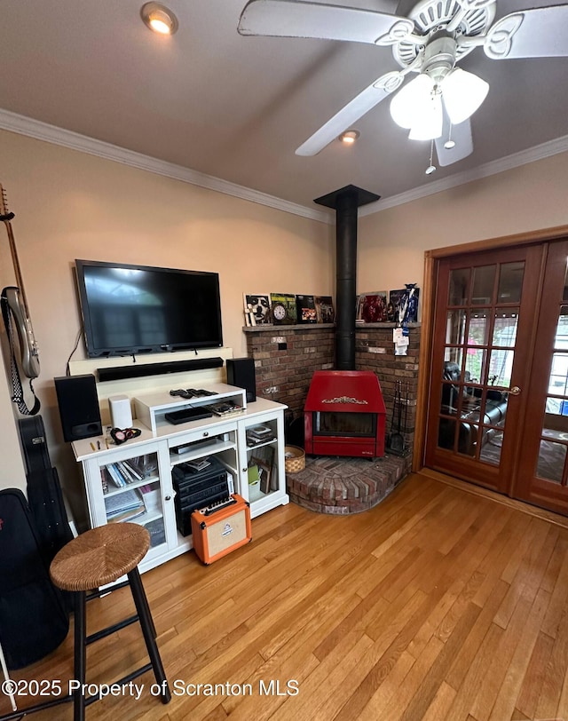1747 Monsey Ave, Scranton, PA 18509 - living room with a wood stove, crown molding, hardwood / wood-style floors, and a ceiling fan
