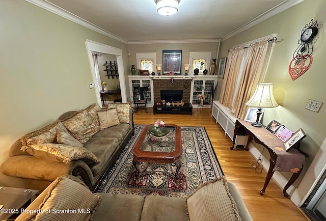 1747 Monsey Ave, Scranton, PA 18509 - living area with wood finished floors, a brick fireplace, and crown molding