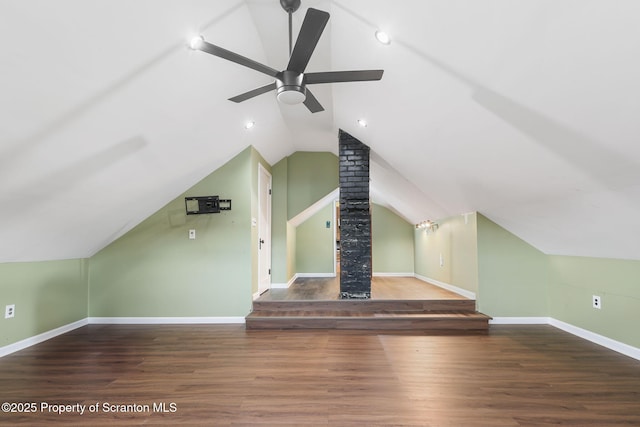 bonus room featuring vaulted ceiling, a ceiling fan, baseboards, and wood finished floors