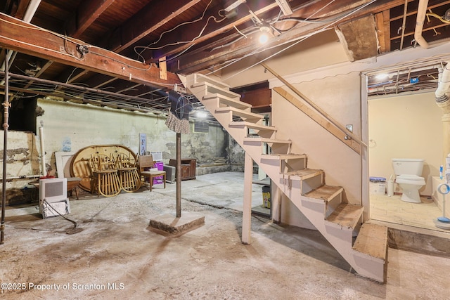 unfinished basement with stairs