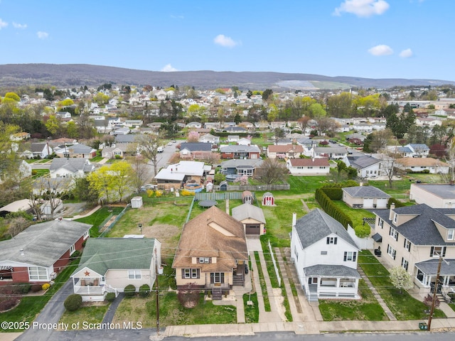 aerial view with a mountain view and a residential view