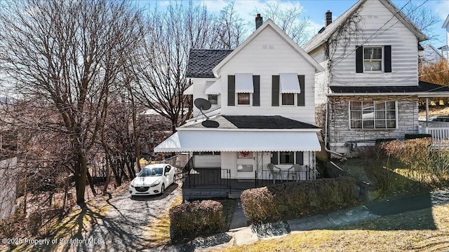 view of front of house featuring covered porch and stone siding