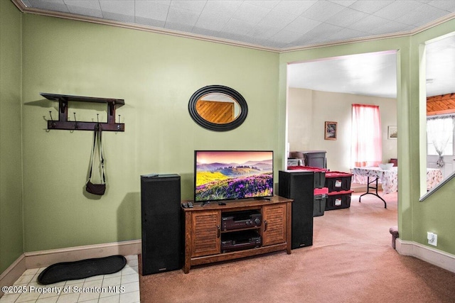 living area with baseboards, carpet, and ornamental molding