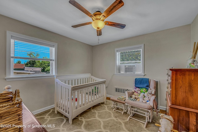 201 Franklin St, Dunmore, PA 18512 - bedroom featuring multiple windows and ceiling fan
