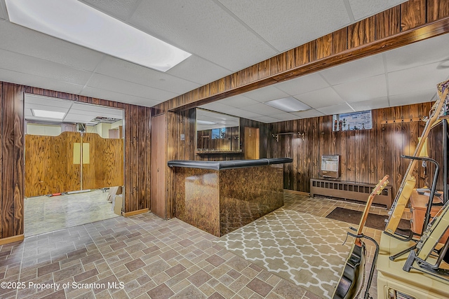 201 Franklin St, Dunmore, PA 18512 - bar area with wood walls, a drop ceiling, and brick patterned floors
