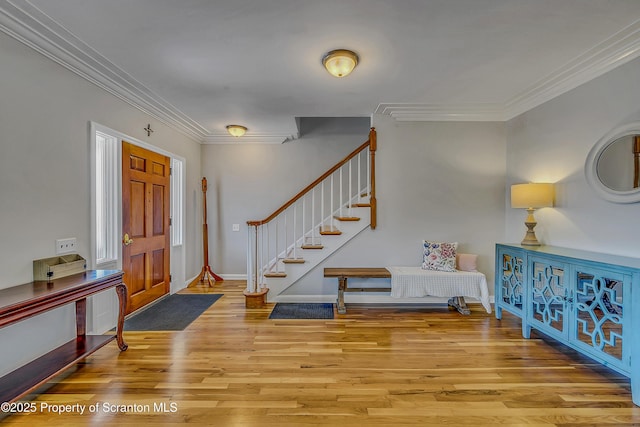 201 Franklin St, Dunmore, PA 18512 - entryway with ornamental molding, wood finished floors, and stairway