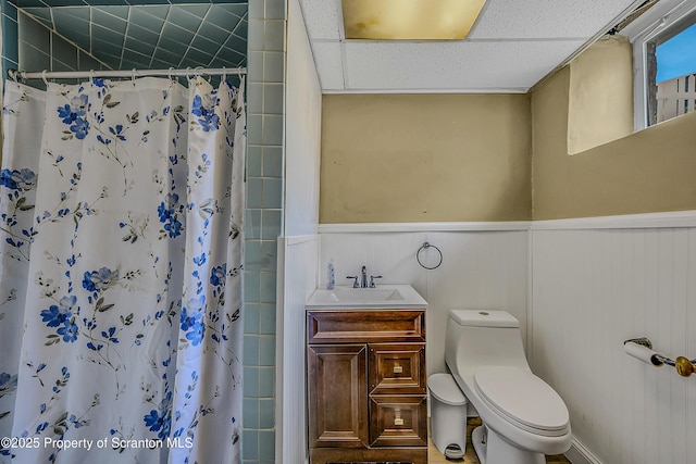 201 Franklin St, Dunmore, PA 18512 - full bath featuring wainscoting, vanity, a shower with curtain, and a drop ceiling