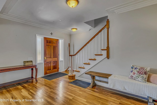 201 Franklin St, Dunmore, PA 18512 - foyer entrance with ornamental molding, wood finished floors, and stairway
