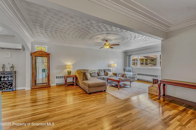 201 Franklin St, Dunmore, PA 18512 - living area featuring radiator, ornamental molding, and light wood finished floors