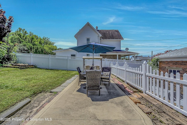 201 Franklin St, Dunmore, PA 18512 - fenced backyard with a patio and outdoor dining area