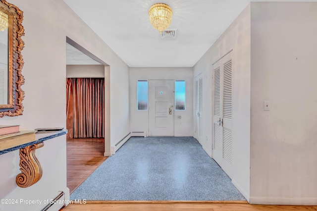 entrance foyer featuring a baseboard heating unit