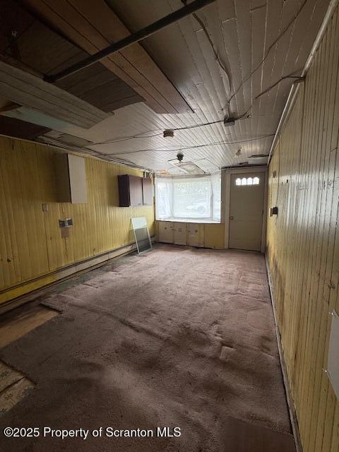 554 Back St, Scranton, PA 18504 - carpeted empty room featuring wooden walls