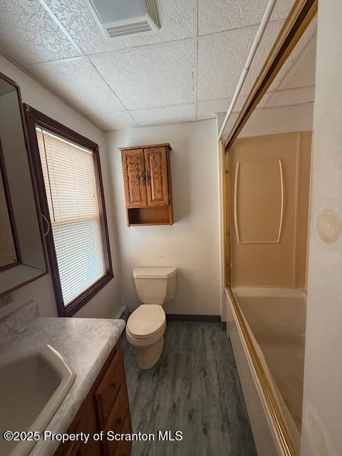 554 Back St, Scranton, PA 18504 - bathroom featuring vanity, wood finished floors, a drop ceiling, and  shower combination