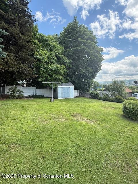 554 Back St, Scranton, PA 18504 - fenced backyard featuring a storage unit