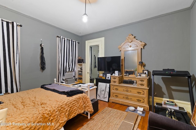 bedroom with wood finished floors