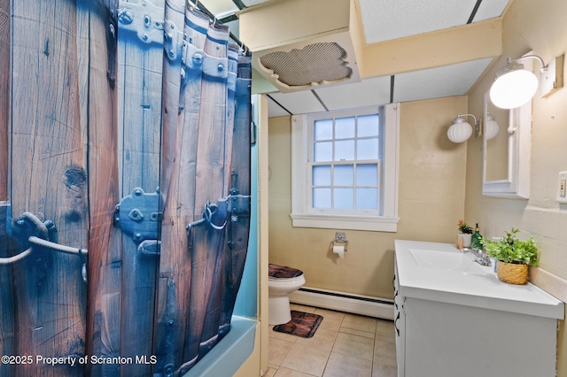 full bathroom with toilet, tile patterned flooring, shower / bath combination with curtain, a baseboard radiator, and vanity