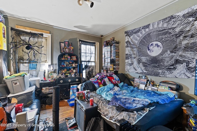 bedroom featuring wood finished floors