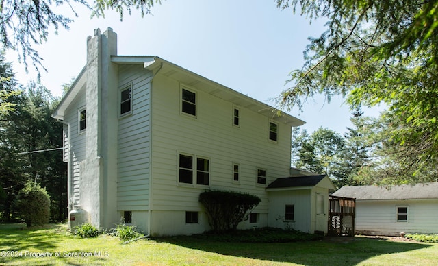 back of house featuring a yard