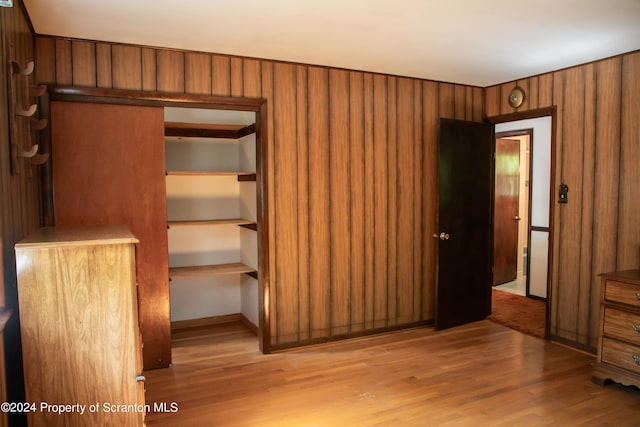 unfurnished bedroom featuring a closet and light hardwood / wood-style flooring