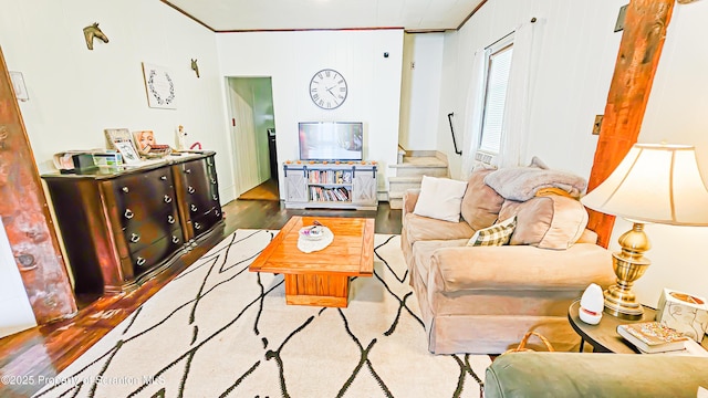 living room with crown molding and wood-type flooring