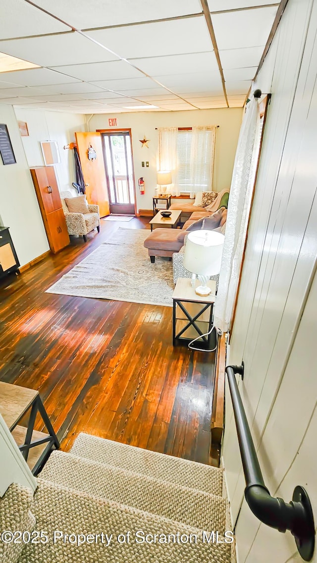 living room with dark hardwood / wood-style flooring