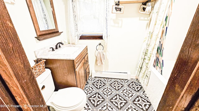 full bathroom with shower / bath combo, baseboard heating, tile patterned flooring, toilet, and vanity