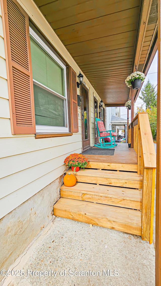 wooden deck featuring a porch