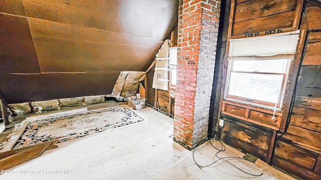 additional living space featuring lofted ceiling