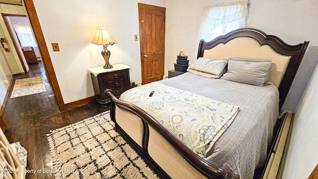 bedroom featuring dark wood-type flooring