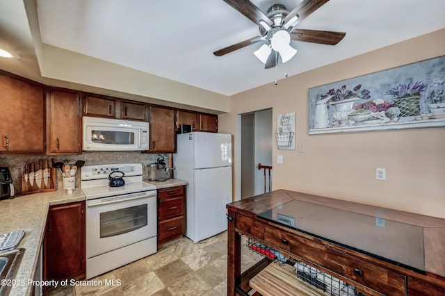 kitchen with ceiling fan, backsplash, and white appliances