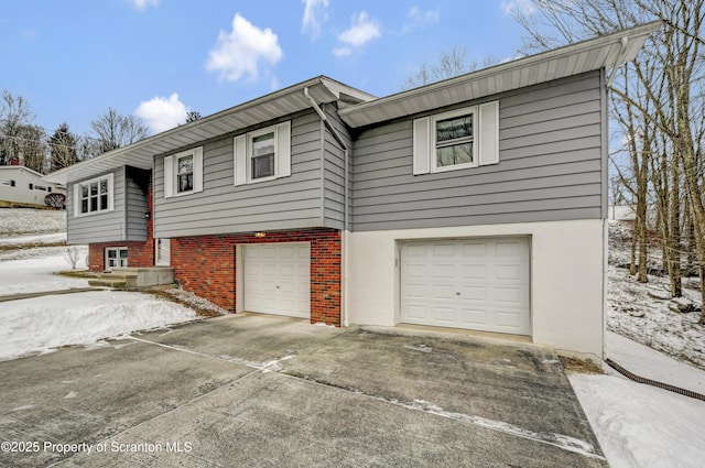 raised ranch featuring a garage